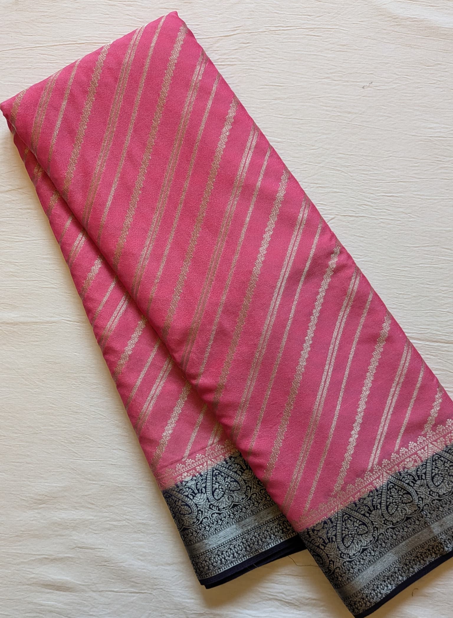 Pink Leheriya Georgette Saree with Navy Blue Woven Border